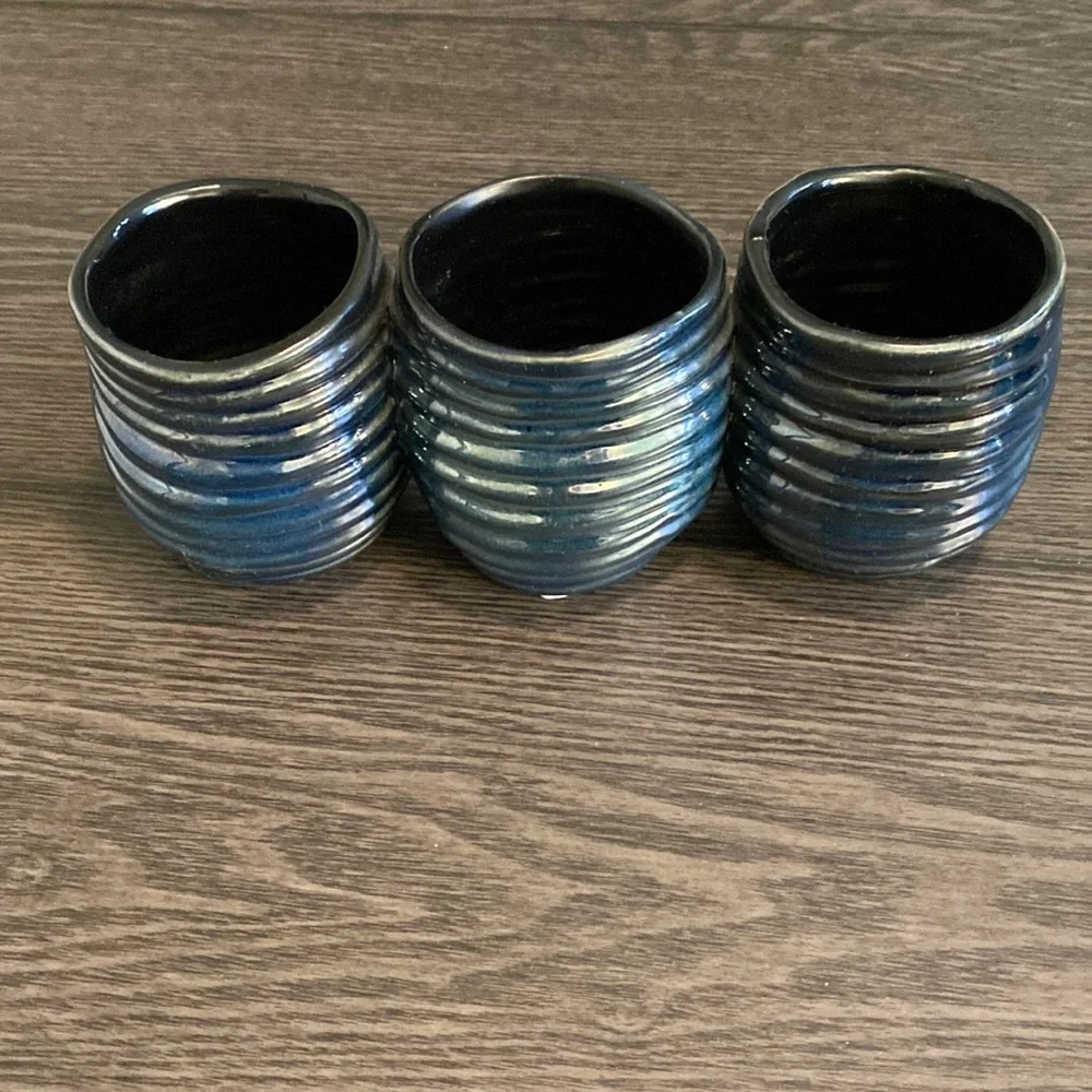 Decorative  clay, metallic blue container. 3 combined vases/cups.